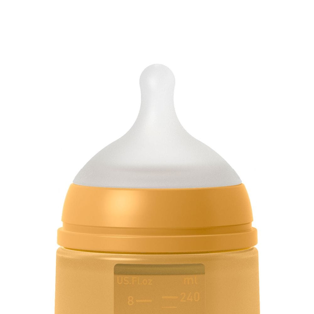 Suavinex Mamadera Mamadera de silicona Anticólico 240 ML Flujo medio Mostaza 308069