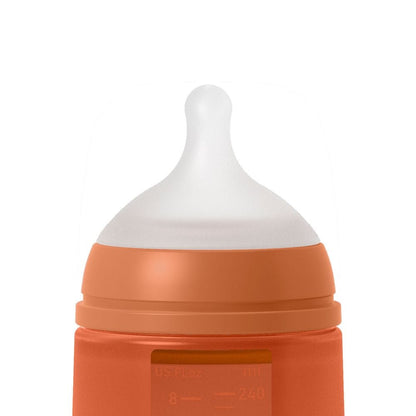 Suavinex Mamadera Mamadera de silicona Anticólico 240 ML Flujo medio Terracota 308068